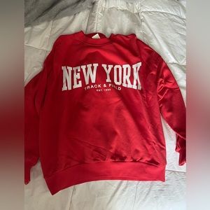 red new york crewneck from H&M. size small. heavy material. very comfy.